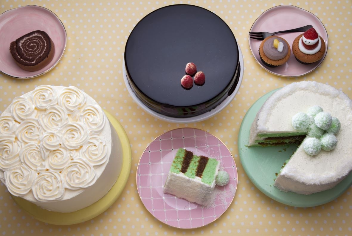 Ondeh ondeh cake, vanilla cake and chocolate cake on the table